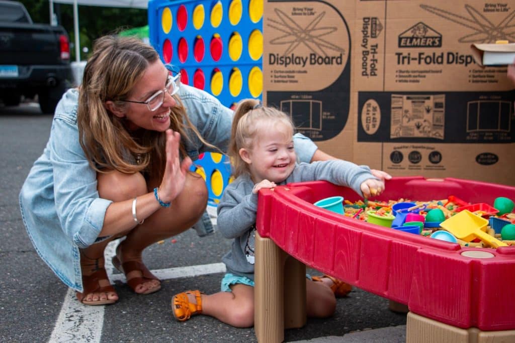 McKenzie with her daughter, Lennox, 3, playing in a Montessori Toy Bin.